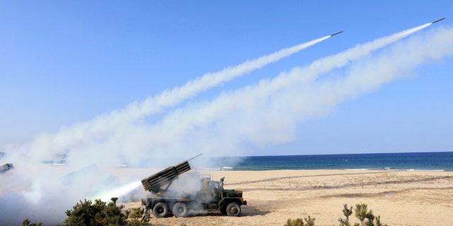 March 3, 2014: South Korean Army's 130mm multiple rocket launchers fire live rounds during an exercise against possible attacks from North Korea in Goseong, South Korea.