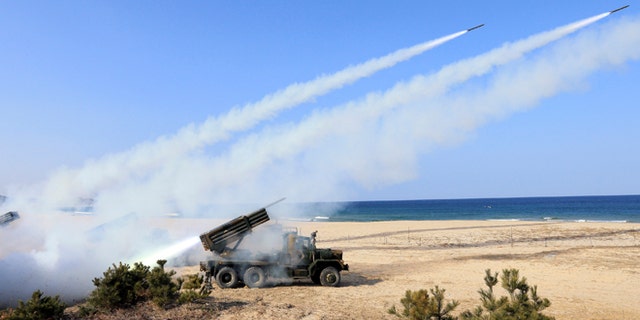 March 3, 2014: South Korean Army's 130mm multiple rocket launchers fire live rounds during an exercise against possible attacks from North Korea in Goseong, South Korea.