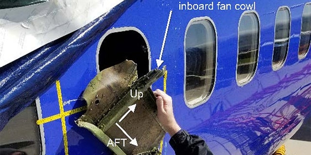 The National Transportation Safety Board's findings show, among other things, a gouge near the plane's shattered window "consistent in shape to a recovered portion of fan cowl and latching mechanism.