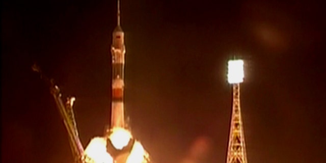 The new Soyuz TMA-01M blasts off with a crew of three astronauts from the Baikonur Cosmodrome in Kazakhstan at 7:10 p.m. EDT (2310 GMT) on Oct. 7, 2010.