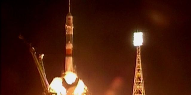 The new Soyuz TMA-01M blasts off with a crew of three astronauts from the Baikonur Cosmodrome in Kazakhstan at 7:10 p.m. EDT (2310 GMT) on Oct. 7, 2010.