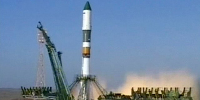 a Soyuz rocket booster carrying Progress supply ship is launched from the Baikonur cosmodrome in Kazakhstan, Wednesday, Aug. 24, 2011.