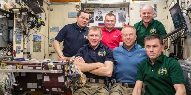 The Expedition 47 crew poses for the three millionth image taken aboard the International Space Station on April 30, 2016.