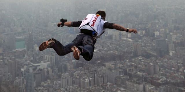 38-year-old Felix Baumgartnerof Austria leaps off the world as tallest completed building, the 508-meter high Taipei 101 Towera in Taiwan.