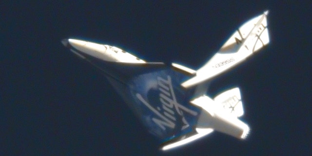 May 4, 2011: Virgin Galactic's suborbital passenger ship SpaceShipTwo flexes its feathered re-entry system during a pivotal glide test at the Mojave Air and Space Port in California.