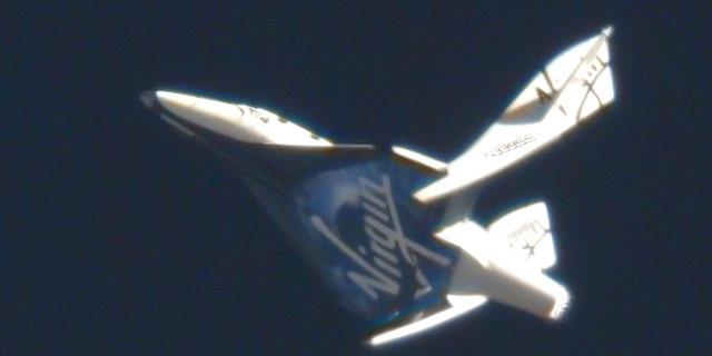 May 4, 2011: Virgin Galactic's suborbital passenger ship SpaceShipTwo flexes its feathered re-entry system during a pivotal glide test at the Mojave Air and Space Port in California.
