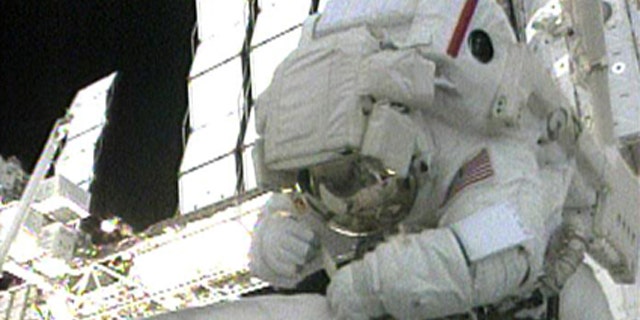 STS-130 Mission Specialist Bob Behnken works outside the International Space Station during the first spacewalk of the STS-130 mission on Feb. 10, 2010.