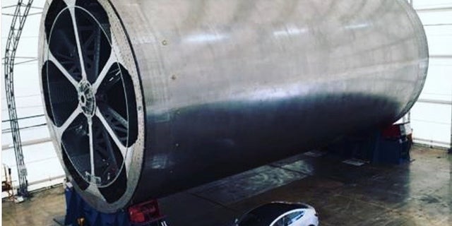 SpaceX founder and CEO Elon Musk posted this photo on Instagram on April 8, 2018. It shows "the main body tool" for the company's Mars-colonizing BFR spaceship, along with a Tesla car for scale.