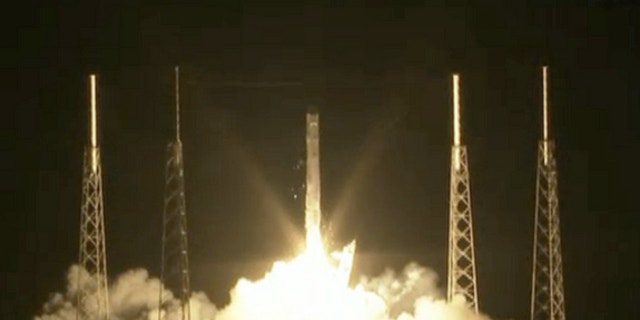 SpaceX's unmanned Dragon capsule launches toward the International Space Station on the first-ever bona fide cargo run for a private American spaceship.