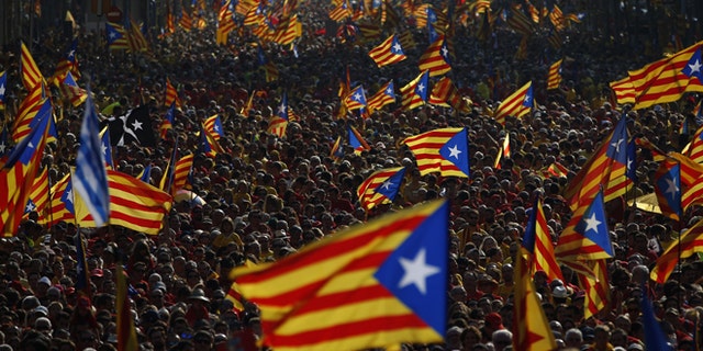 Sept. 11, 2014: Hundreds of thousands of demonstrators stand on the streets waving their estelada flags that symbolizes Catalonia's independence during a protest calling for the independence of Catalonia in Barcelona, Spain.