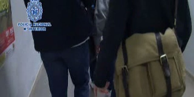 Spanish National Police released footage of the extradition without showing the suspect's face.