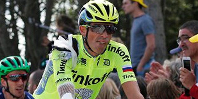 Spain's Alberto Contador crosses the finish line after crashing in the first stage of the Tour de France cycling race over 188 kilometers (116.8 miles) with start in Mont-Saint-Michel and finish in Utah Beach, France, Saturday, July 2, 2016. (AP Photo/Christophe Ena)