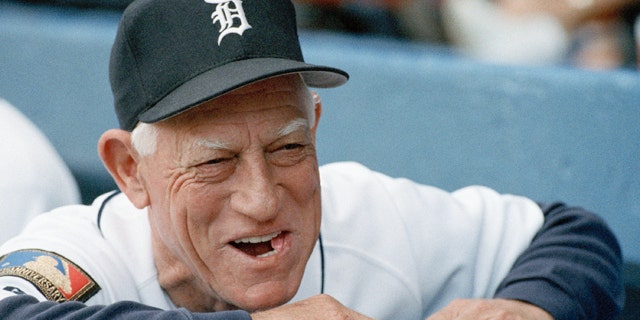 July 26, 1994: Detroit Tigers manager Sparky Anderson smiling as he looks out from the dugout prior to the start of a baseball game against the Seattle Mariners in Detroit.