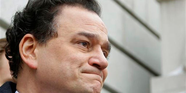 Former Rhode Island House Speaker Gordon Fox begins to tear-up as he stands on the steps of the Federal Courthouse speaking to members of the media after his initial appearance and plea hearing in front of a federal judge.