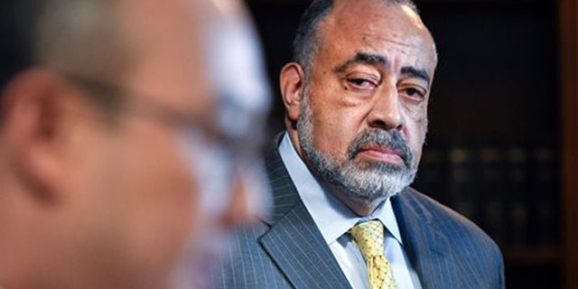 Former U.S. Department of Justice attorney Don Lewis, right, has been added to Ramsey County Attorney John Choi's, team as they investigate the July 6 death of Philando Castile in suburban St. Paul, Minn. "This independent perspective can only enhance the integrity and legitimacy of our decision in this case," Choi, left, said Friday, July 29, 2016. "This is ultimately what justice requires." (Glen Stubbe/Star Tribune via AP)