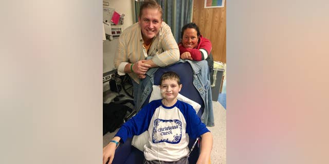 December 2016: Spencer with his dad Ken Kolman and his mom Liz Kolman at St. Louis Children’s Hospital after his transplant.
