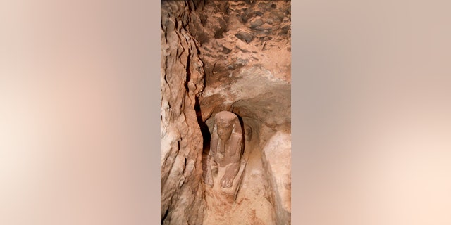 This undated photo released by the Egyptian Ministry of Antiquities, shows the latest discovery of a statue with a lion's body and a human head, in the Temple of Kom Ombo in Aswan, Egypt (Egyptian Ministry of Antiquities via AP)