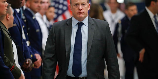 White House press secretary Sean Spicer walks down the hallway during President Donald Trump's visit to the Pentagon, Thursday, July 20, 2017. White House Press Secretary Sean Spicer has resigned over hiring of new communications aide. (AP Photo/Pablo Martinez Monsivais)