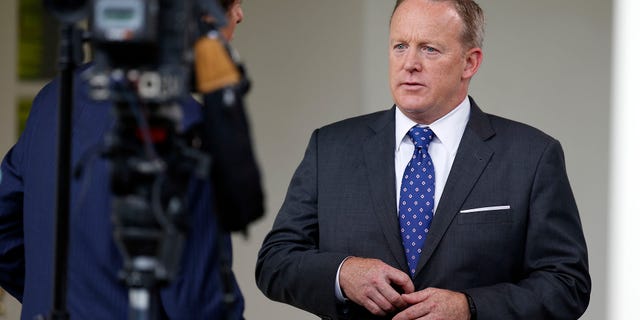 White House press secretary Sean Spicer does a television interview at the White House, Friday, June 23, 2017, in Washington. (AP Photo/Alex Brandon)