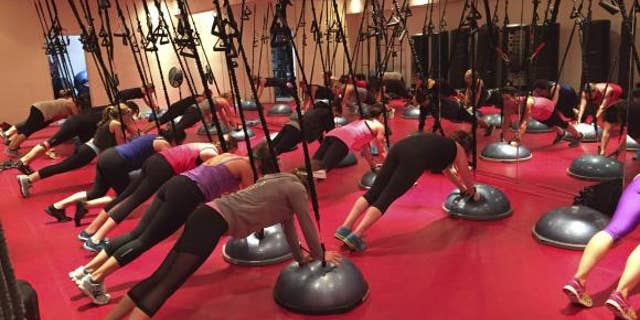 Participants work out during a Spiderband fitness class in a handout picture taken at Fuel Fitness in Brooklyn, New York, in October, 2014.