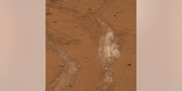 The jammed front wheel of NASA’s Spirit rover dug this trench inside Mars’ Gusev Crater in 2008. Spirit’s observations allowed researchers to determine that the white material is evidence of an ancient hydrothermal system on the Red Planet.