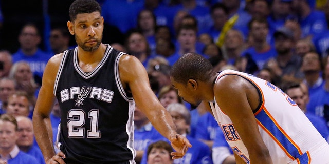 May 12, 2016: San Antonio Spurs center Tim Duncan (21) talks with Oklahoma City Thunder forward Kevin Durant, right, during the fourth quarter of Game 6 of a second-round NBA playoff series in Oklahoma City.