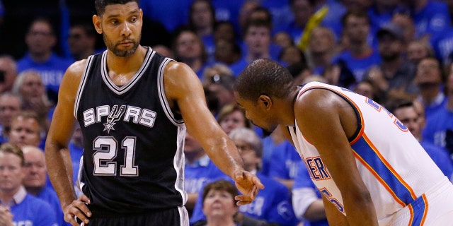 May 12, 2016: San Antonio Spurs center Tim Duncan (21) talks with Oklahoma City Thunder forward Kevin Durant, right, during the fourth quarter of Game 6 of a second-round NBA playoff series in Oklahoma City.