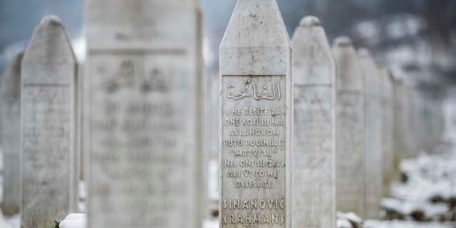 Saturday, March 7, 2015: This photo taken in the memorial cemetery Potocari, outside Srebrenica, shows the gravestone of Muriz Sinanovic. Sinanovic was among the 8,000 Muslim Bosniak men and boys killed in July 1995 Srebrenica massacre.