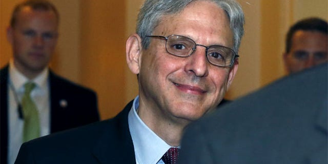 FILE; Judge Merrick Garland walks after a breakfast with Senate Judiciary Committee Chair Senator Chuck Grassley.