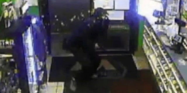 An armed robbery suspect was splashed in the face with hot coffee Sunday at a gas station in Muncie, Ind.