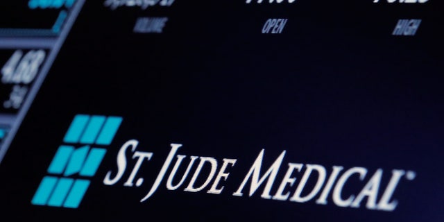 The ticker and trading information for St. Jude Medical is displayed where the stock is traded on the floor of the New York Stock Exchange (NYSE) in New York City, U.S., April 28, 2016.