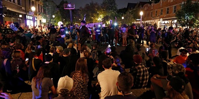Protesters gather, Friday, Sept. 15, 2017, in St. Louis, after a judge found a white former St. Louis police officer, Jason Stockley, not guilty of first-degree murder in the death of a black man, Anthony Lamar Smith, who was fatally shot following a high-speed chase in 2011. (AP Photo/Jeff Roberson)