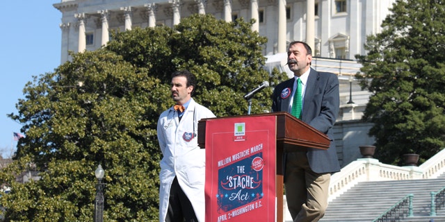 Feb. 20, 2012: Aaron Perlut, left, chairman of the American Mustache Institute, and John Yeutter of Northeastern State University promote a proposal to give a $250 tax refund to mustached Americans.