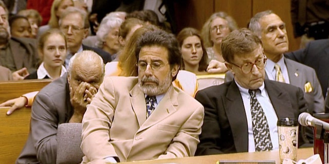 Michael Peterson, right, and his attorney David Rudolf after Peterson's guilty verdict is announced at his trial in 2003.