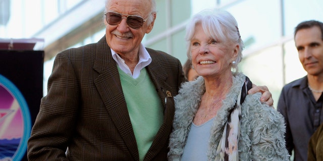 Comic book creator Stan Lee poses with his wife Joan after he received a star on the Hollywood Walk of Fame in Los Angeles in January 2011.