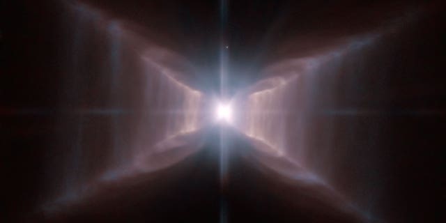 An image of star HD 44179, surrounded by an extraordinary structure known as the Red Rectangle. This image was captured by the Hubble Space Telescope.