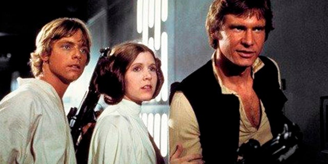 From left: Mark Hamill as Luke Skywalker, Carrie Fisher as Princess Leia Organa, and Harrison Ford as Hans Solo in the original 1977 "Star Wars: Episode IV - A New Hope."