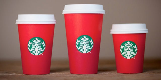 Starbucks' new holiday cup is has a simple red design devoid of the regular designs.