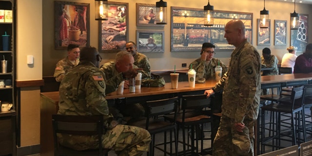 April 24, 2017: Active military personnel from Fort Campbell gather at one of Starbucks' new "Military Family Stores" in Clarksville, Tenn.