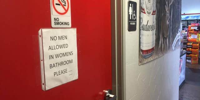Sign on women's restroom door at BBQ on the Brazos restaurant in Texas.