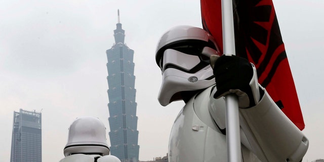 File photo - Fans dressed as Storm Trooper from "Star Wars" pose in front of landmark building Taipei 101 during Star Wars Day in Taipei, Taiwan May 4, 2017. (REUTERS/Tyrone Siu)