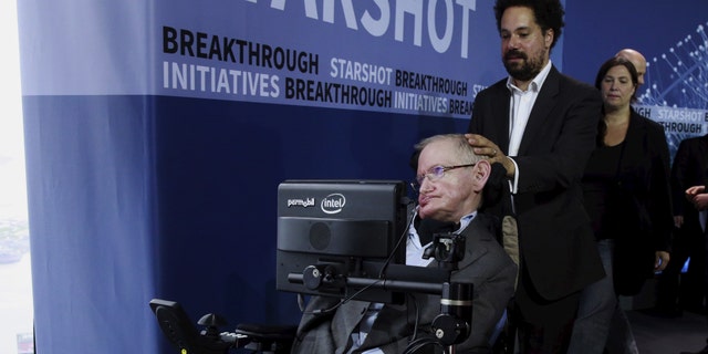 Physicist Stephen Hawking exits the stage during an announcement of the Breakthrough Starshot initiative with investor Yuri Milner in New York April 12, 2016. REUTERS/Lucas Jackson - RTX29N6G