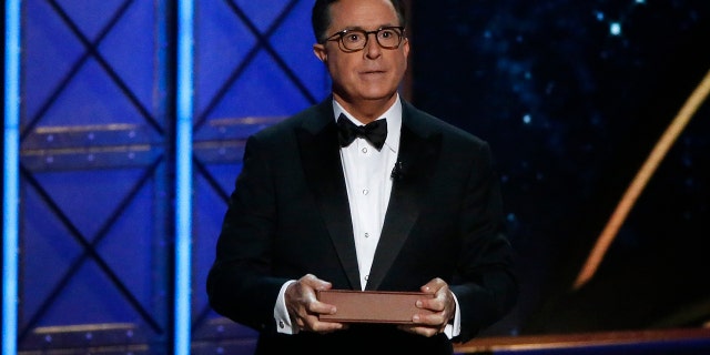 The 69th Primetime Emmy Awards Show in Los Angeles, California, Sept. 17, 2017. Host Stephen Colbert holds a book as he speaks during the show. He'll be vying for another set of media awards this year, #TheFakies Awards.
