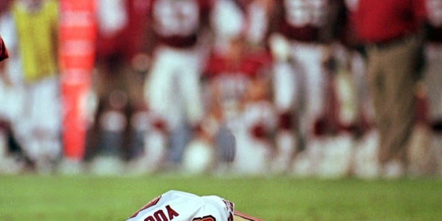 San Francisco 49ers' quarterback Steve Young lays motionless on field after suffering a concussion in the second quarter of the 49ers' game against the Arizona Cardinals Monday Sept. 27, 1999 in Tempe, Arizona.