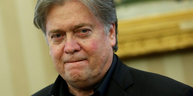 File photo - White House senior advisor Steve Bannon attends as U.S. President Donald Trump signs executive orders in the Oval Office at the White House in Washington, U.S. Jan. 28, 2017. (REUTERS/Jonathan Ernst)