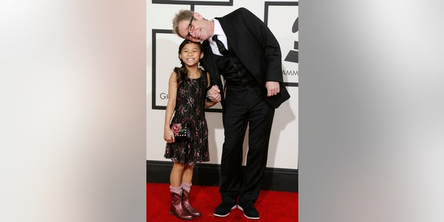 Contemporary Christian artist Steven Curtis Chapman and his daughter arrive at the 56th annual Grammy Awards in Los Angeles, California January 26, 2014.