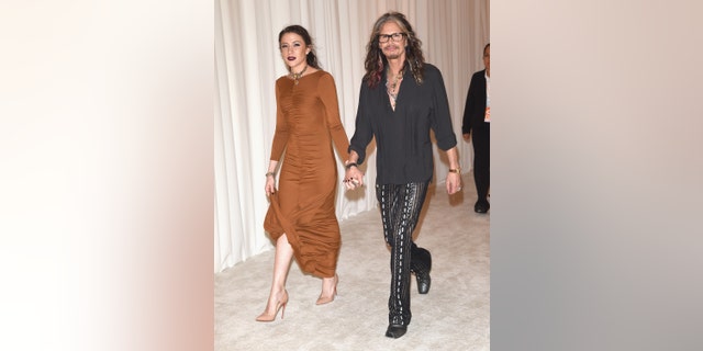 February 28, 2016. Singer Steven Tyler (R) and Aimee Ann Preston attend Bulgari at the 24th Annual Elton John AIDS Foundation's Oscar Viewing Party.