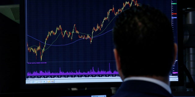 File photo: A Specialist trader looks at a chart at his post on the floor of the New York Stock Exchange (NYSE) in New York, U.S., May 10, 2017. (REUTERS/Brendan McDermid)