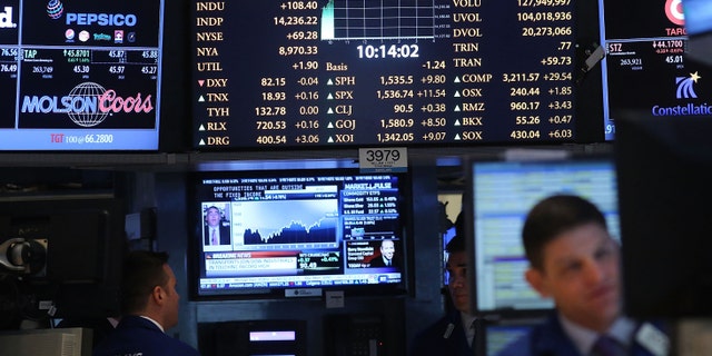 Traders work the floor of the New York Stock Exchange.