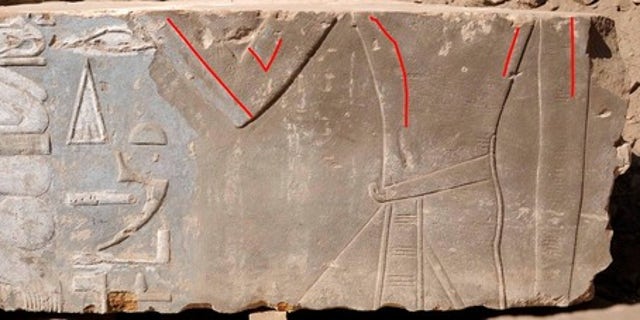 A stone block found on Egypt's Elephantine Island shows Queen Hatshepsut as a female (highlighted by red lines). Later images of the pharaoh portrayed her as a male king.